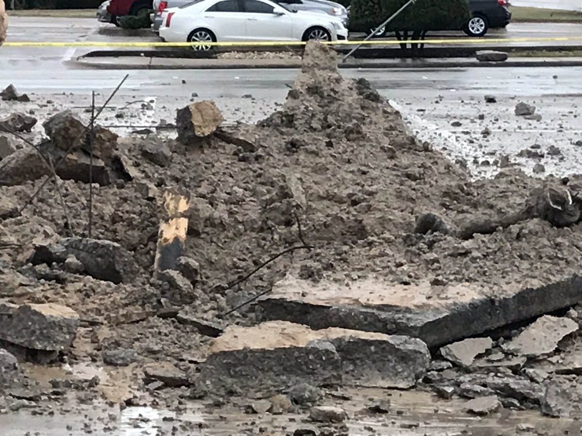 A lightning strike in this north Fort Worth parking lot makes a large hole and sends debris flying through the air. No injuries reported.