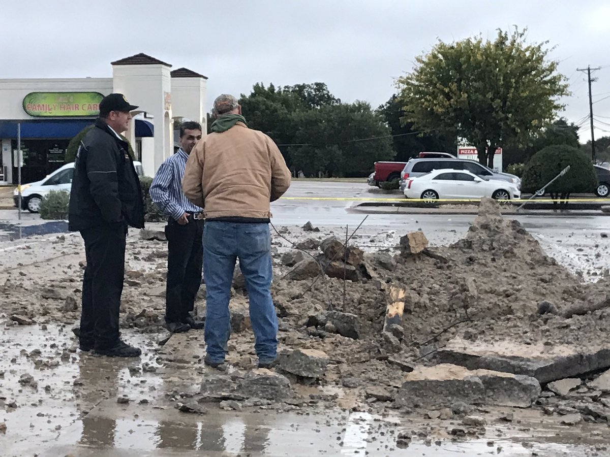 A lightning strike in this north Fort Worth parking lot makes a large hole and sends debris flying through the air. No injuries reported.