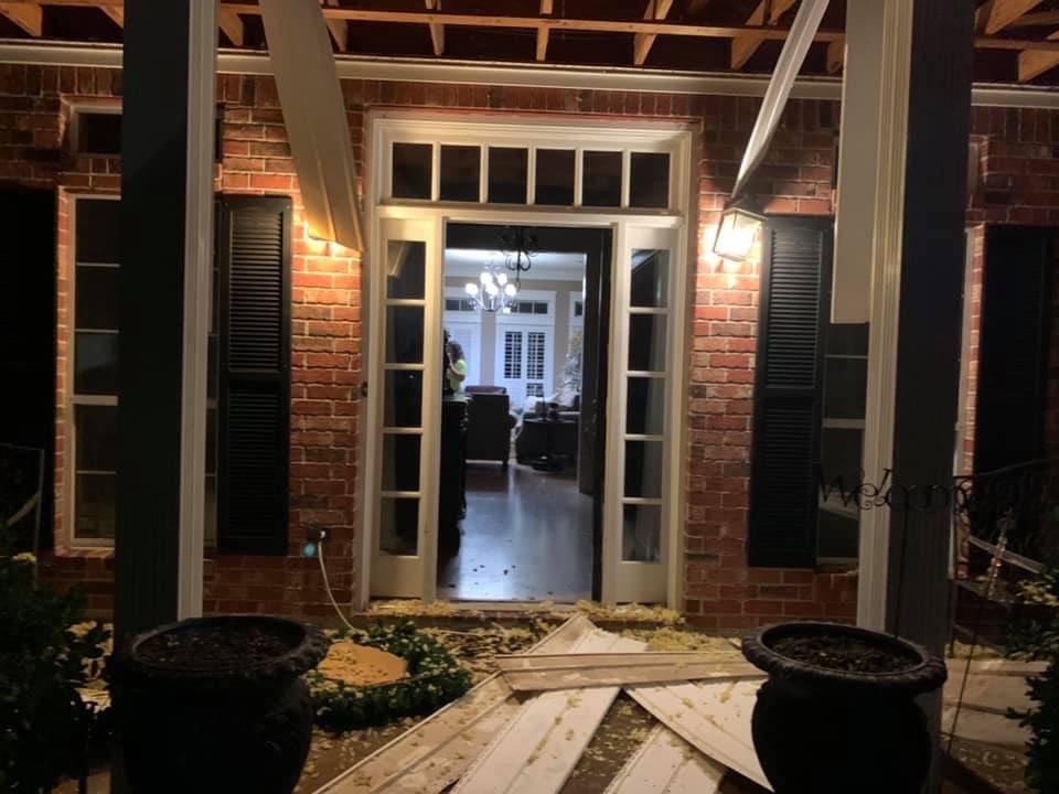 Here is the house damage. Both garage doors are sucked in as well. 
