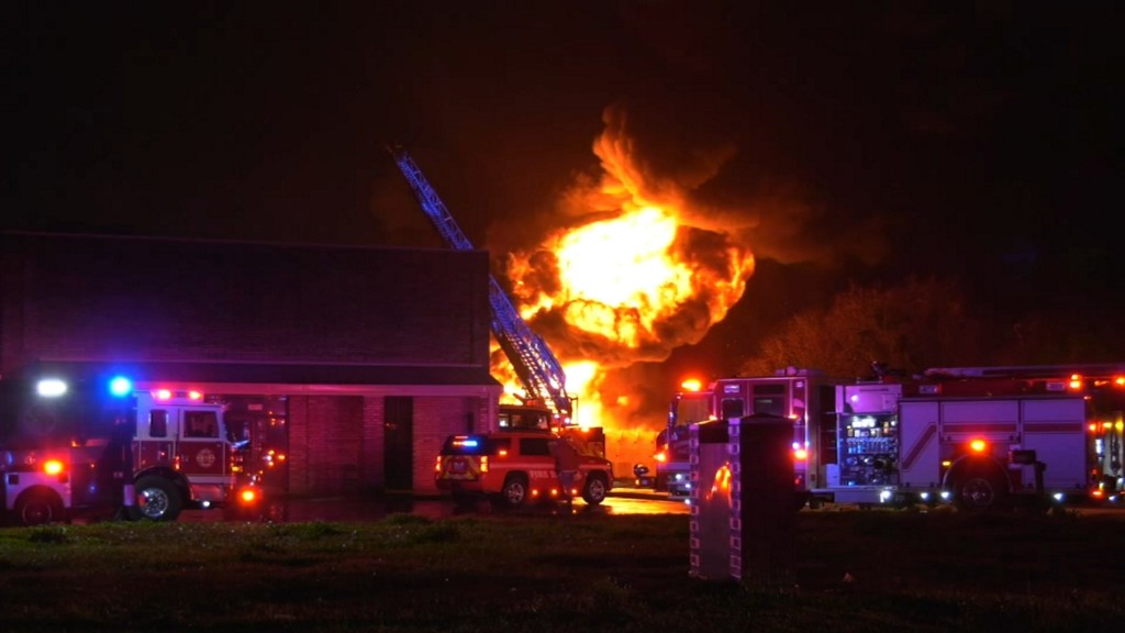 Plastic pallets on fire at commercial building near Bush Airport