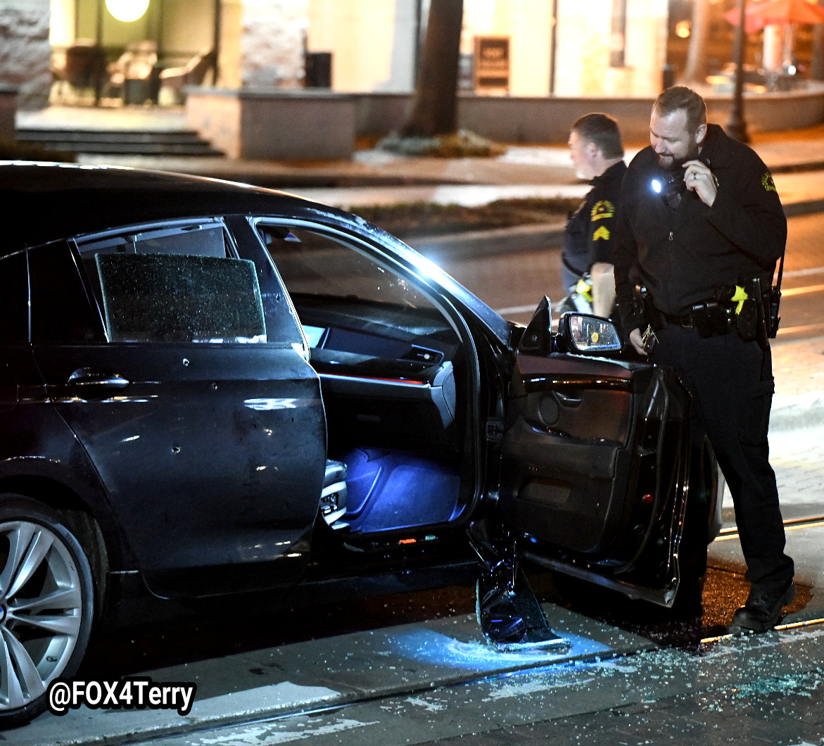 A bullet riddled BMW sits along McKinney Ave in Uptown as police work to learn who opened fire on the car seriously wounding a woman. 