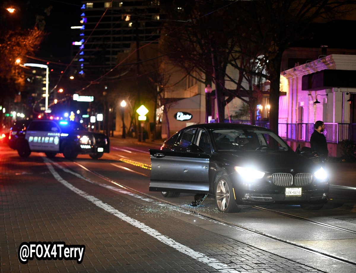 A bullet riddled BMW sits along McKinney Ave in Uptown as police work to learn who opened fire on the car seriously wounding a woman. 