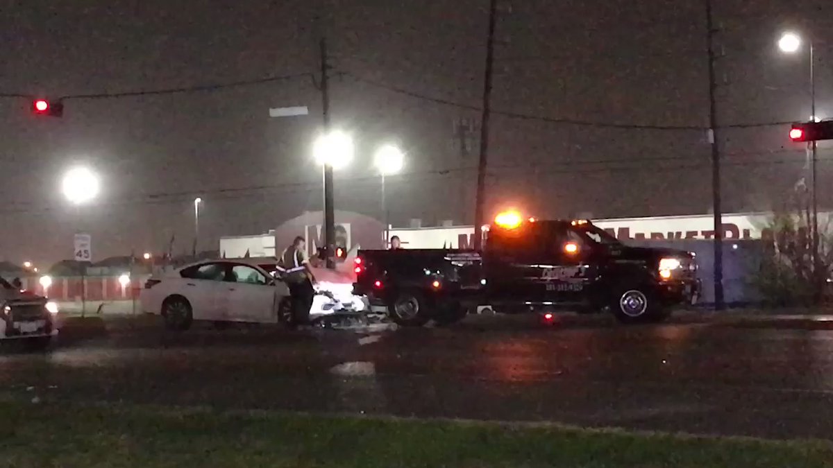 Driver of Nissan Altima, man in his 20s, died after he slammed into back of an SUV stopped at a red light, investigators say. Look at how far that SUV traveled—almost into glass wall of strip mall.