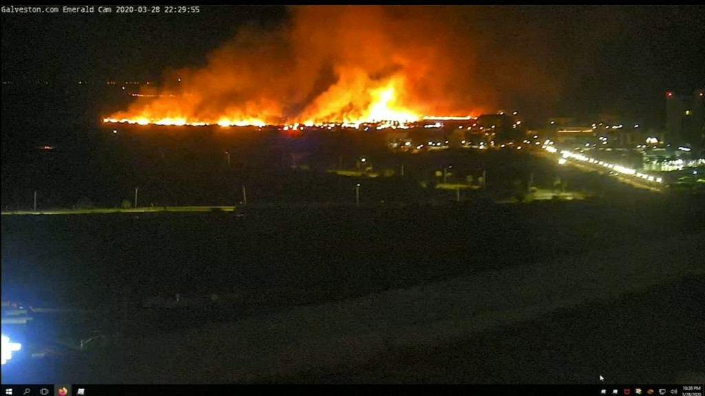 Firefighters responding to large grass fire in Galveston on East Beach. No injuries have been reported.