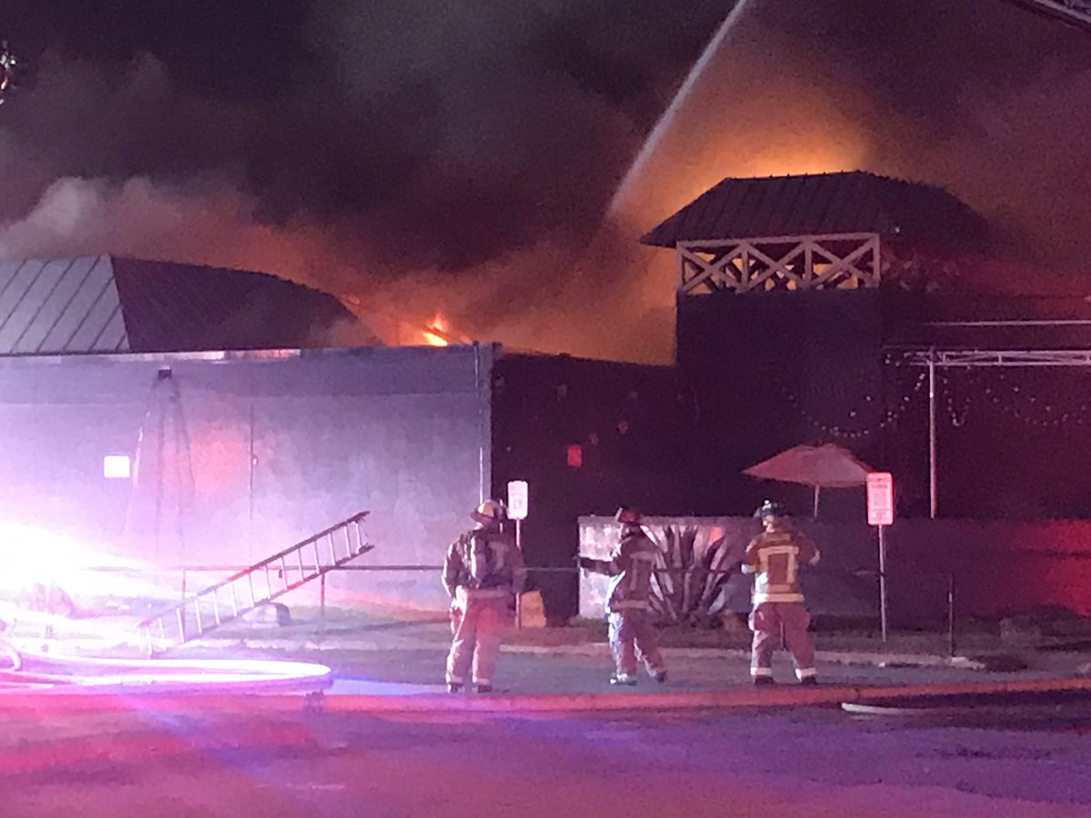 Dallas Fire Rescue on scene Composite near I-35 in NW Dallas working a large structure fire. Firefighters continue to battle this 2 Alarm blaze from all sides