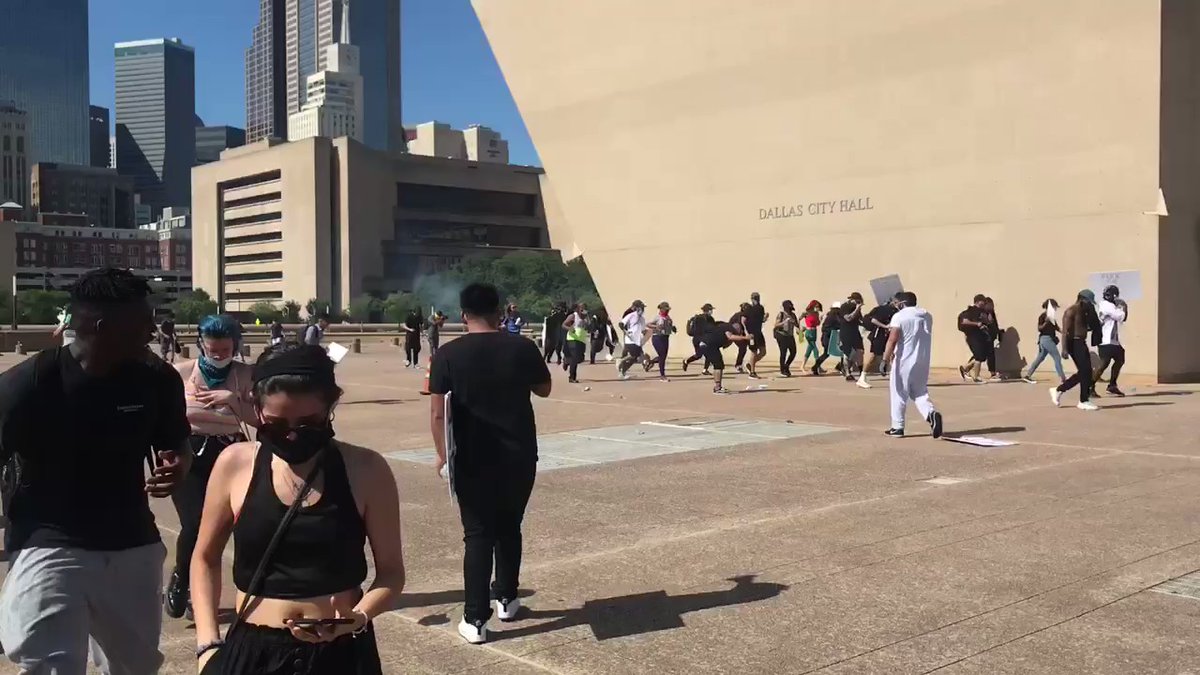 Protestors are clearing Dallas city hall plaza. Police fired multiple tear gas canisters. @dallasnews