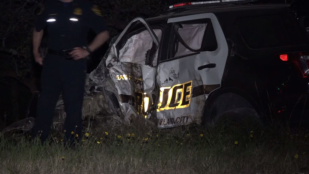 Police officer pulled out of burning patrol car, rushed to hospital