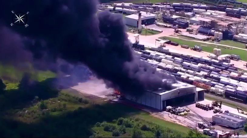 Evacuations underway following large chemical fire near Houston, Texas  Hockley l TX Hazmat crews are on scene of a large fire at an oil recycling plant. Train cars carrying explosive material sit within yards of the fire. Mandatory evacuations are now underway