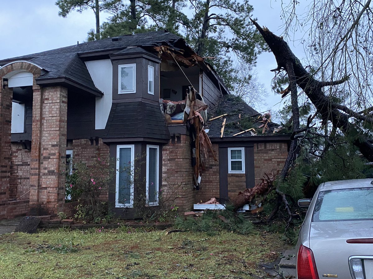 The tornado clipped a tree, with a branch hitting her home -