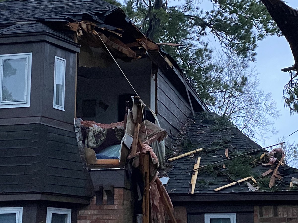 The tornado clipped a tree, with a branch hitting her home -