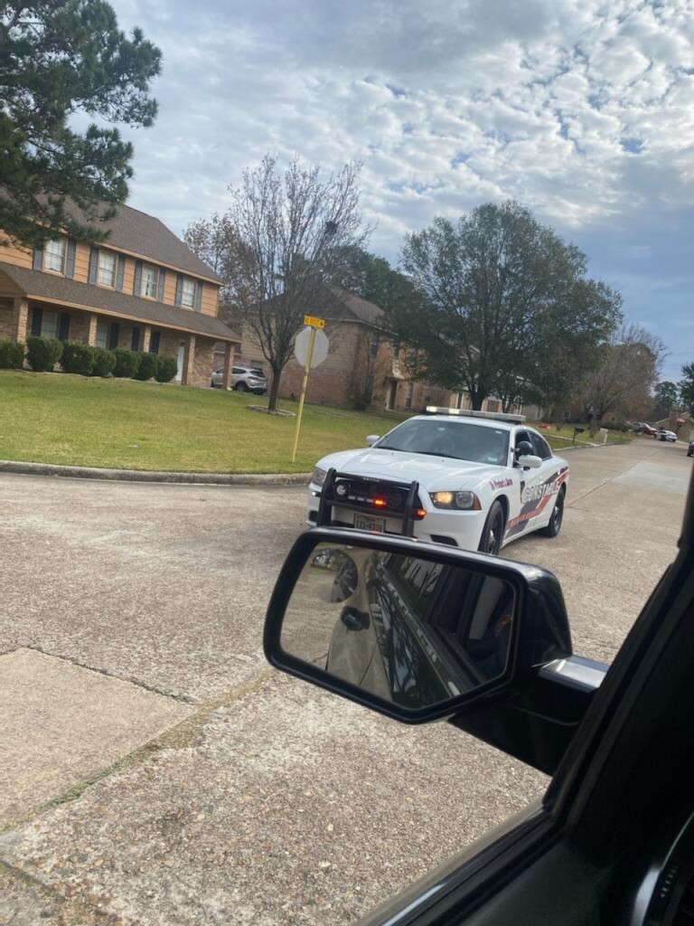 Heavy police presence in the 5400 block of Mossy Timbers Drive.   Constable Deputies are searching for yesterday's barricaded suspect, who is described as a white male wearing black sweater with white dots.   