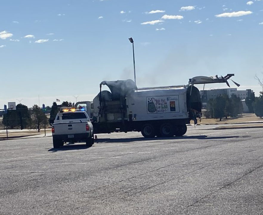 This was at the parking lot of Legacy Play Village around 10:30 a.m. Thursday. A sanitation truck had smoke pouring out and dumped its load in the parking lot. fire Our photographer said LFR was not called out, but several city trucks were at the scene