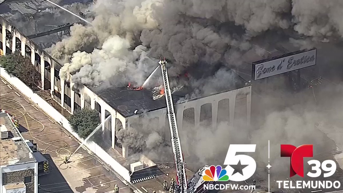 Firefighters with Dallas Fire-Rescue are working to put out a 2-alarm fire at a vacant two-story building in far North Dallas.