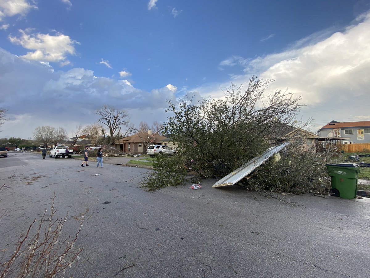 Scene in Round Rock a few hours ago. Residents on Southwestern Trail calling it total destruction after tornado touched down. Roofs ripped off, trees split in half, and debris strewn everywhere. Everyone here is okay as far as we can tell.