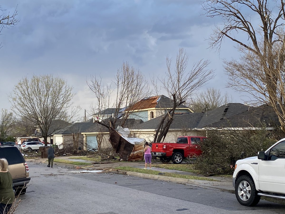 Scene in Round Rock a few hours ago. Residents on Southwestern Trail calling it total destruction after tornado touched down. Roofs ripped off, trees split in half, and debris strewn everywhere. Everyone here is okay as far as we can tell.