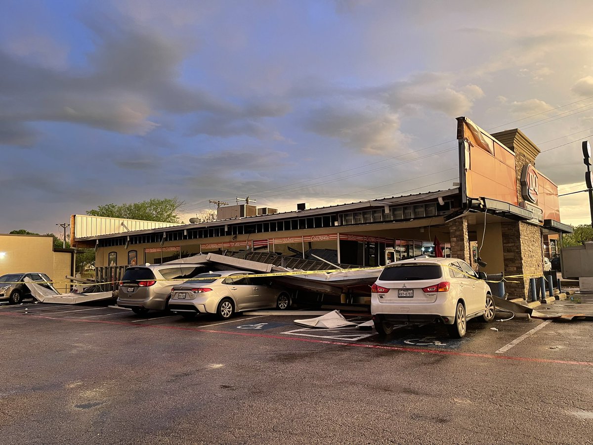 Storm damage in Ennis at Dairy Queen.   general manager said about 10 people were inside, no one was injured.  Side of the building and some customer cars are damaged.  GM told this is the 2nd storm they've experienced damage