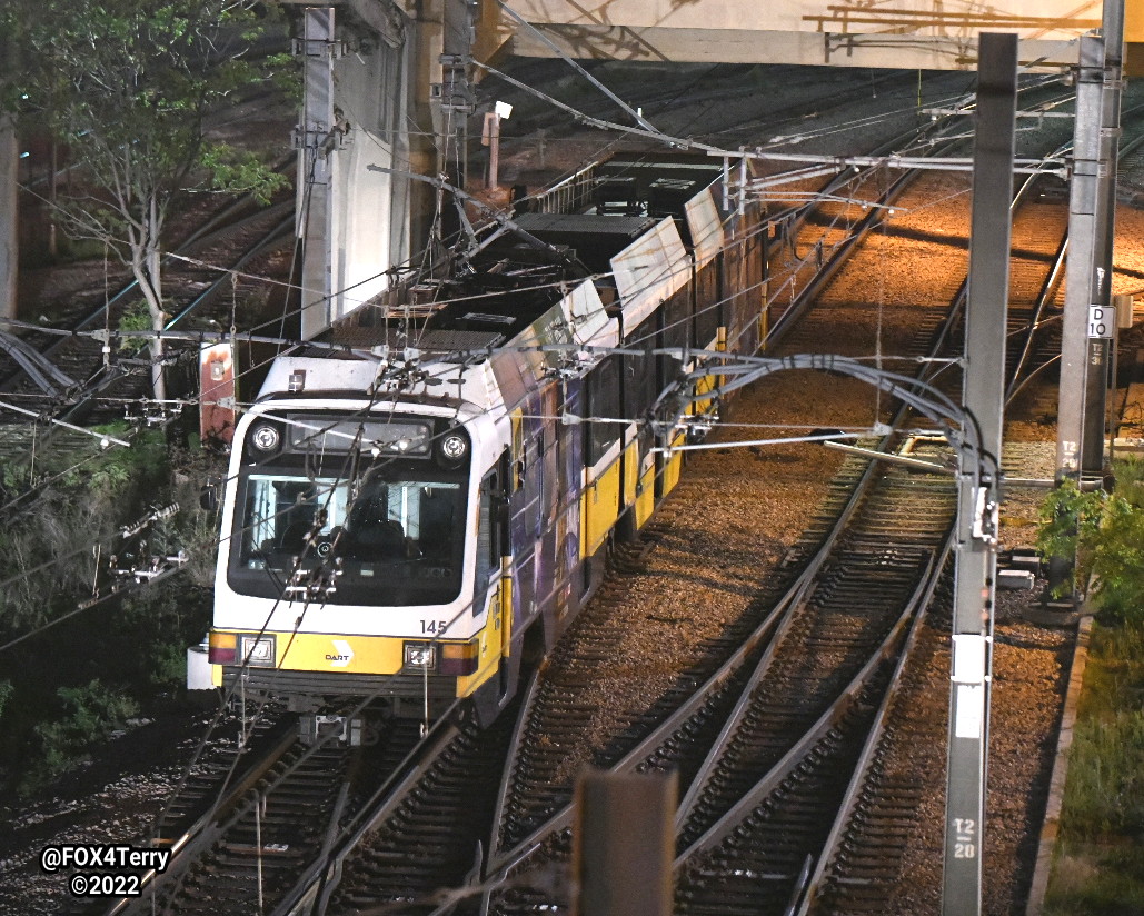 A car plunges off the Houston Street Viaduct. As it falls the car takes down the catenary, the power lines that run DART trains. DART officials say it could take days to repair the damage.