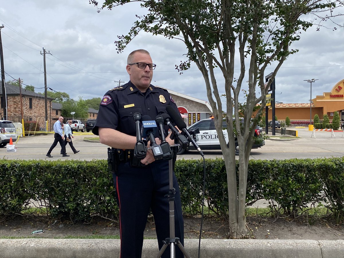 Police say the suspect had a gun pointing in the air and different directions. The bullet hole in the vehicle unit is from the Officer inside the unit shooting out towards the suspect 