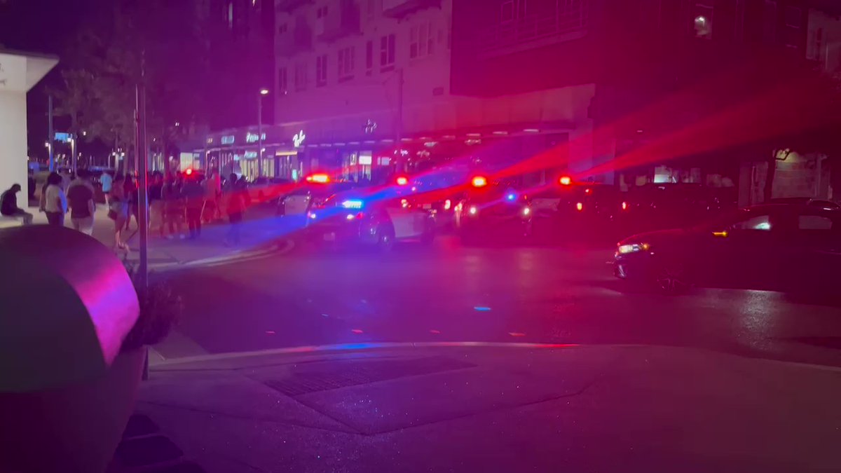 Multiple people surround scene after 2 shots were fired. Shooter is reported in custody. None injured. - Shooting occurred around 8:30 PM. Crowds fled in panic, at were first initially through to be fireworks