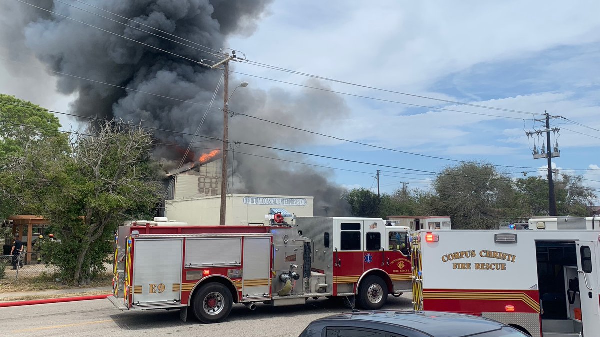 Emergency crews responding to large fire involving a building and several vehicles at 910 N. Staples St.