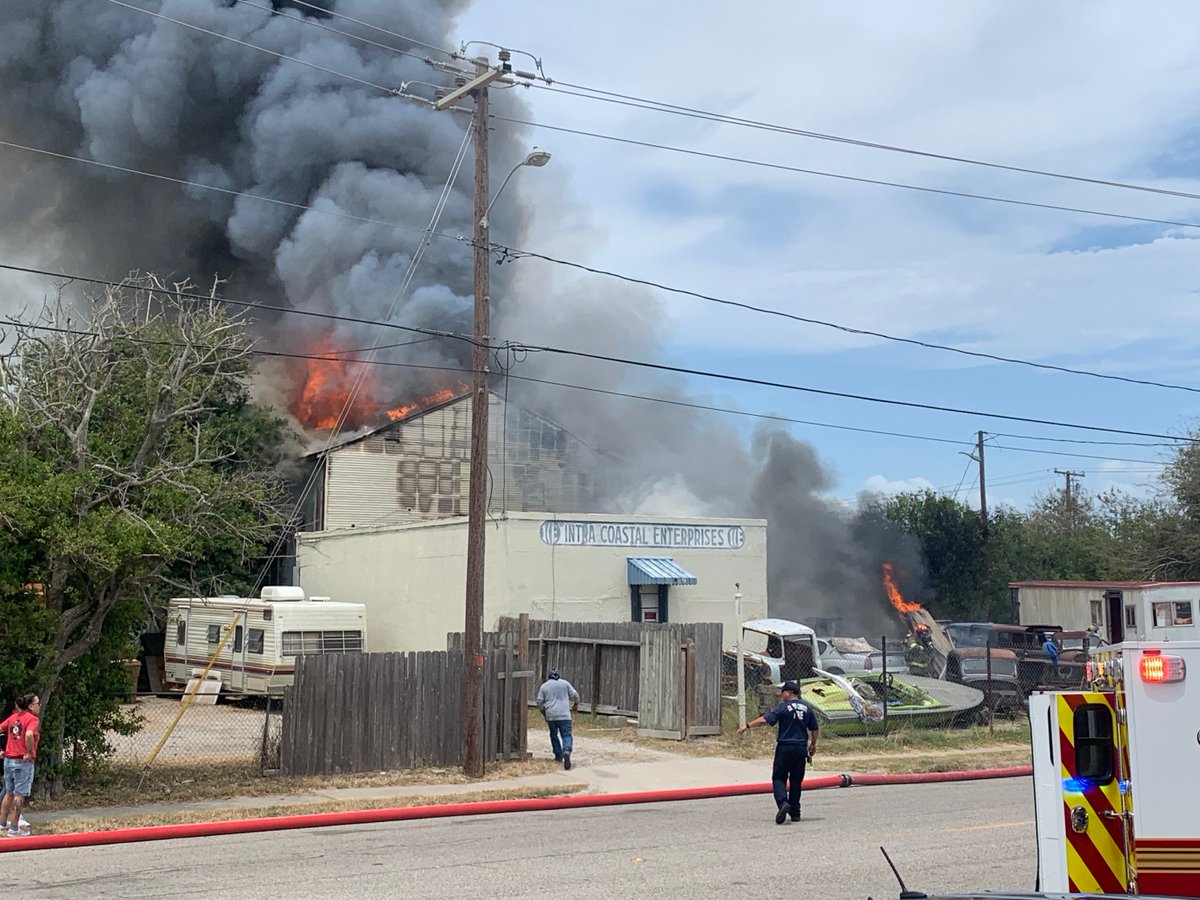 Emergency crews responding to large fire involving a building and several vehicles at 910 N. Staples St.