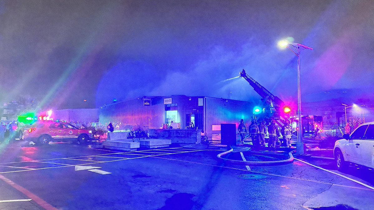 The fire department is still here in scene of this warehouse fire. We are right near command where they are making a plan. 