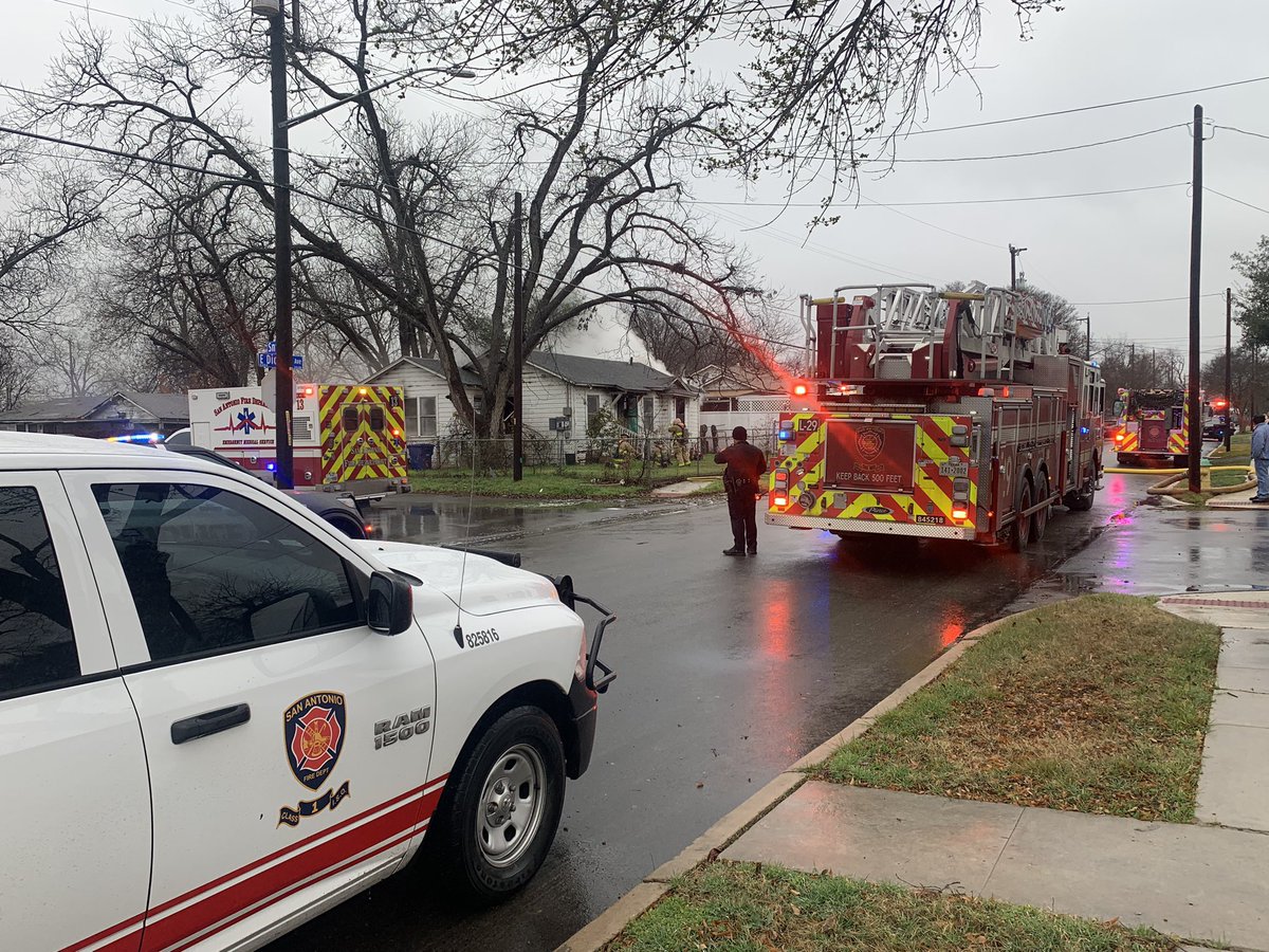 A fire breaks out at 215 E Dickson. Fire officials say San Antonio police  officers pulled out a woman from a burning home. The woman was then transported to Samc with what is believed to be some burns. Fire is being investigated