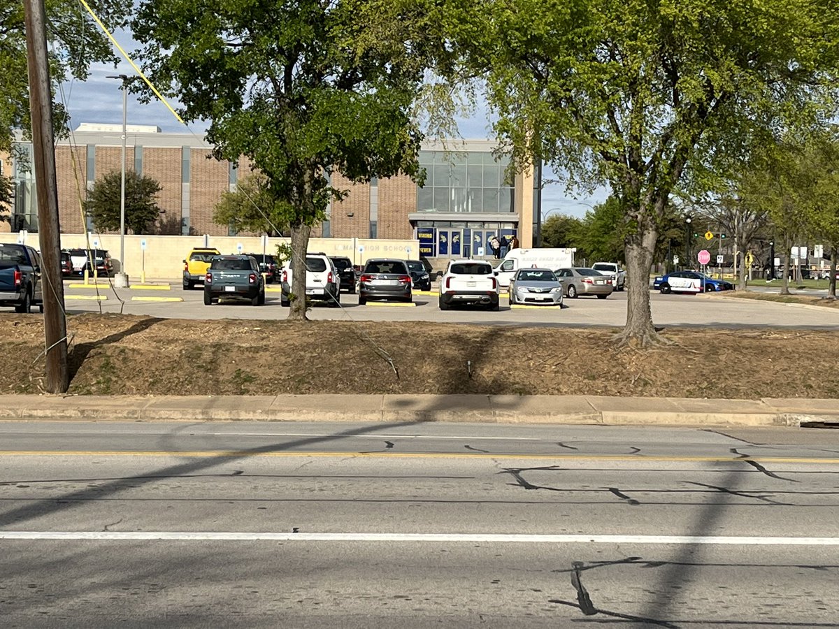 Parents are now waiting for a spot to pick up their kids outside Lamar HS. Arlington PD is telling parents not to come to the school. They'll announce a pick up location when the lockdown is lifted. The shooting was before school started, so not all students were on campus
