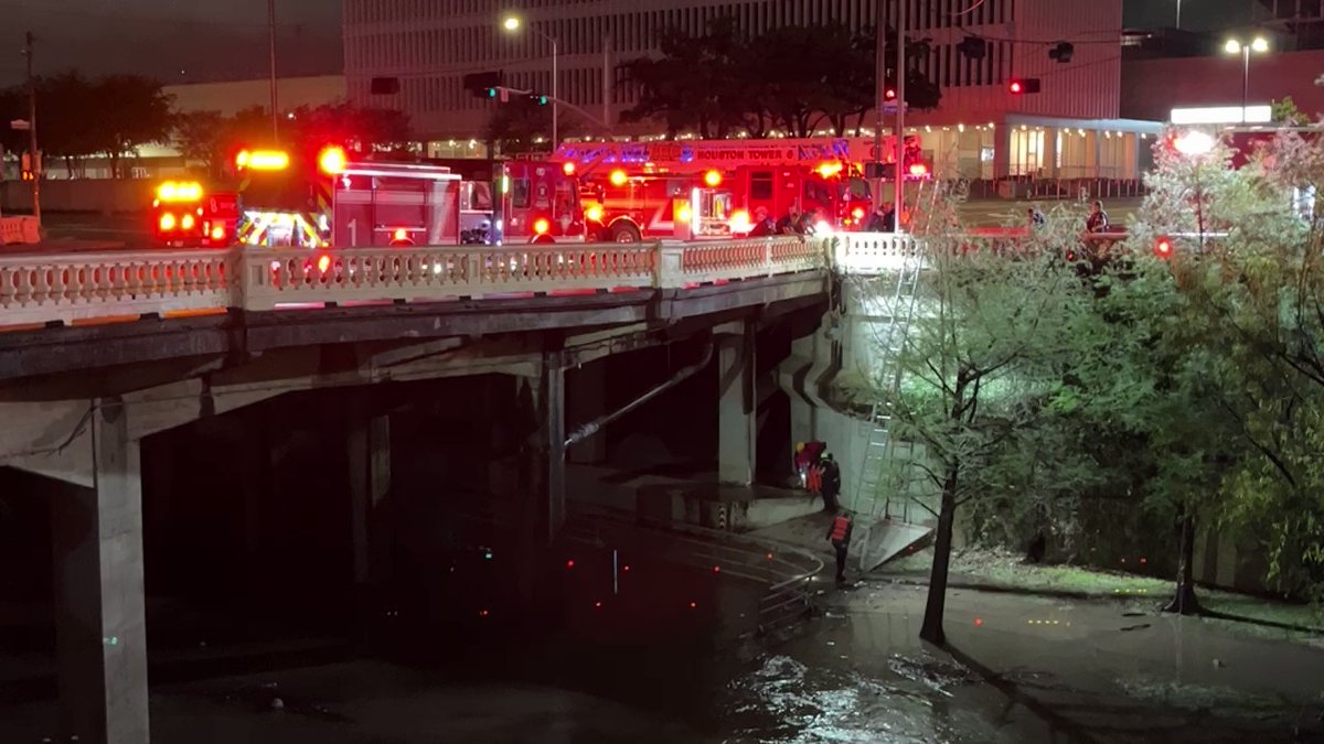 Houston fire is helping to rescue at least one person from high water under the bridge at smith and Congress
