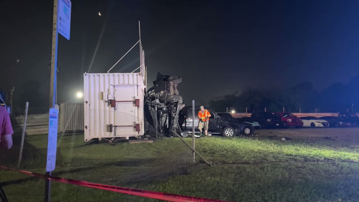 A driver  and passenger inside this black Chevy flipped multiple times and  slammed into this shipping container off the 59 feeder near Little York. nThe driver was shot twice allegedly by someone in another car and died. The passenger managed to survive