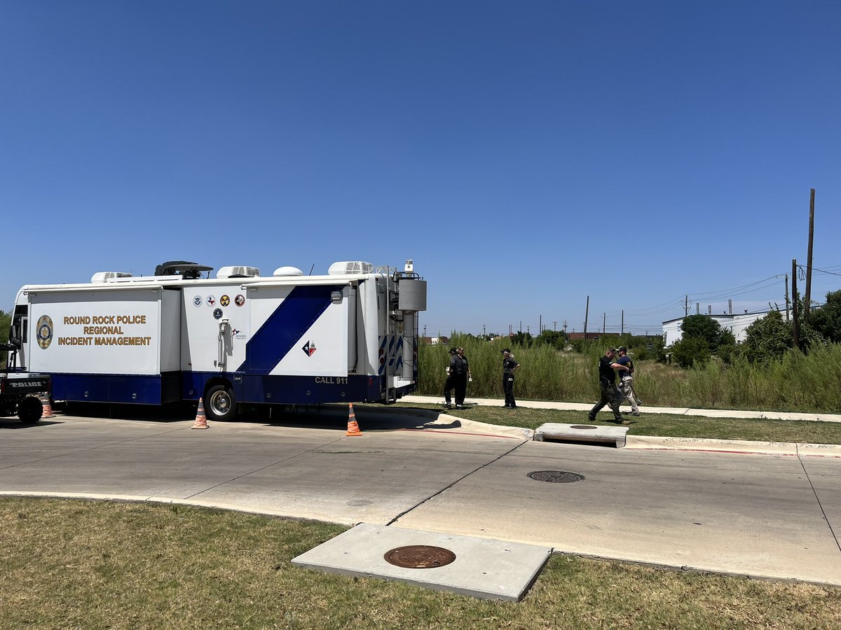 Law enforcement searching a field in Pflugerville, Texas in connection with accused serial killer Raul Meza Jr
