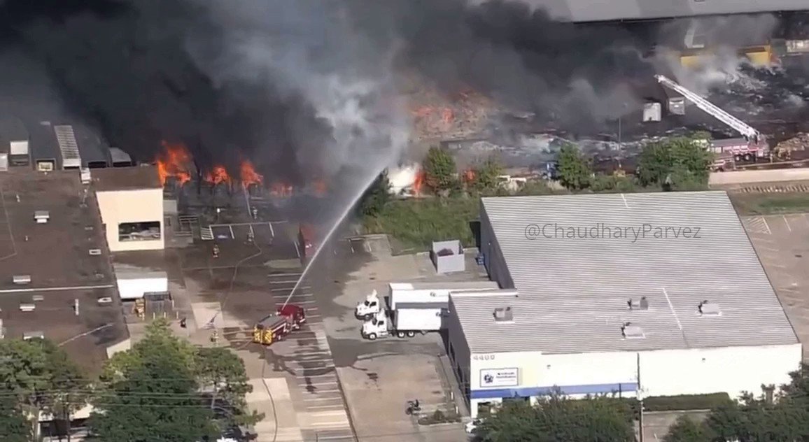 Firefighters are battling a large fire at a recycling center warehouse in Houston, Texas nnOfficials have stated that one person is receiving medical treatment due to smoke inhalation