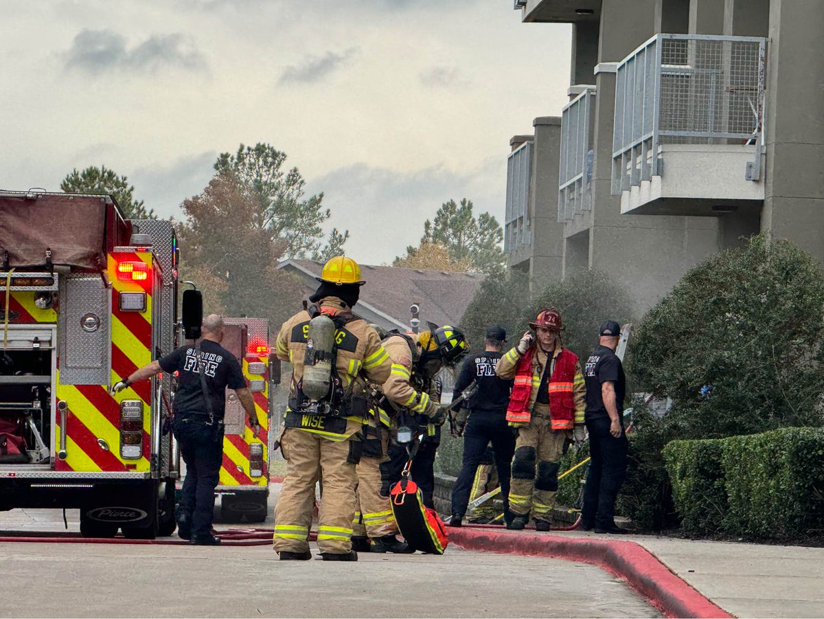 Heavy police presence at the Pierpoint Apartments located in the 23770 block of Springwoods Village Pkwy. The caller advised heavy smoke was coming out of her neighbor's apartment.  Spring Fire Department is on scene and it was discovered that the dryer caught on fire