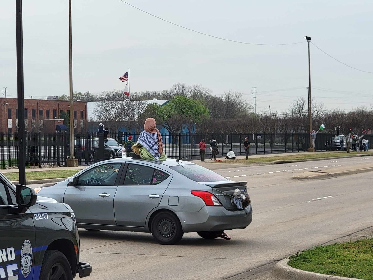 Garland PD is on scene of a protest that has blocked Glenbrook Drive in front of General Dynamics.