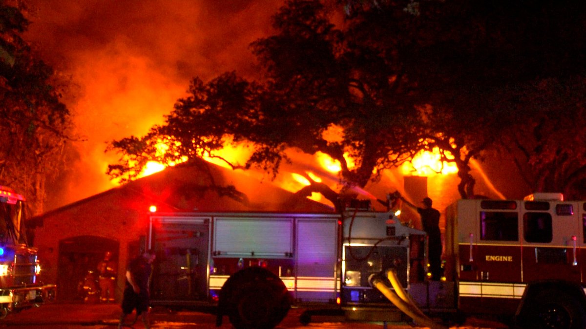 A firefighter was hospitalized after battling a massive house fire on the North Side off Whisper Path Street near Lockhill Selma Road.