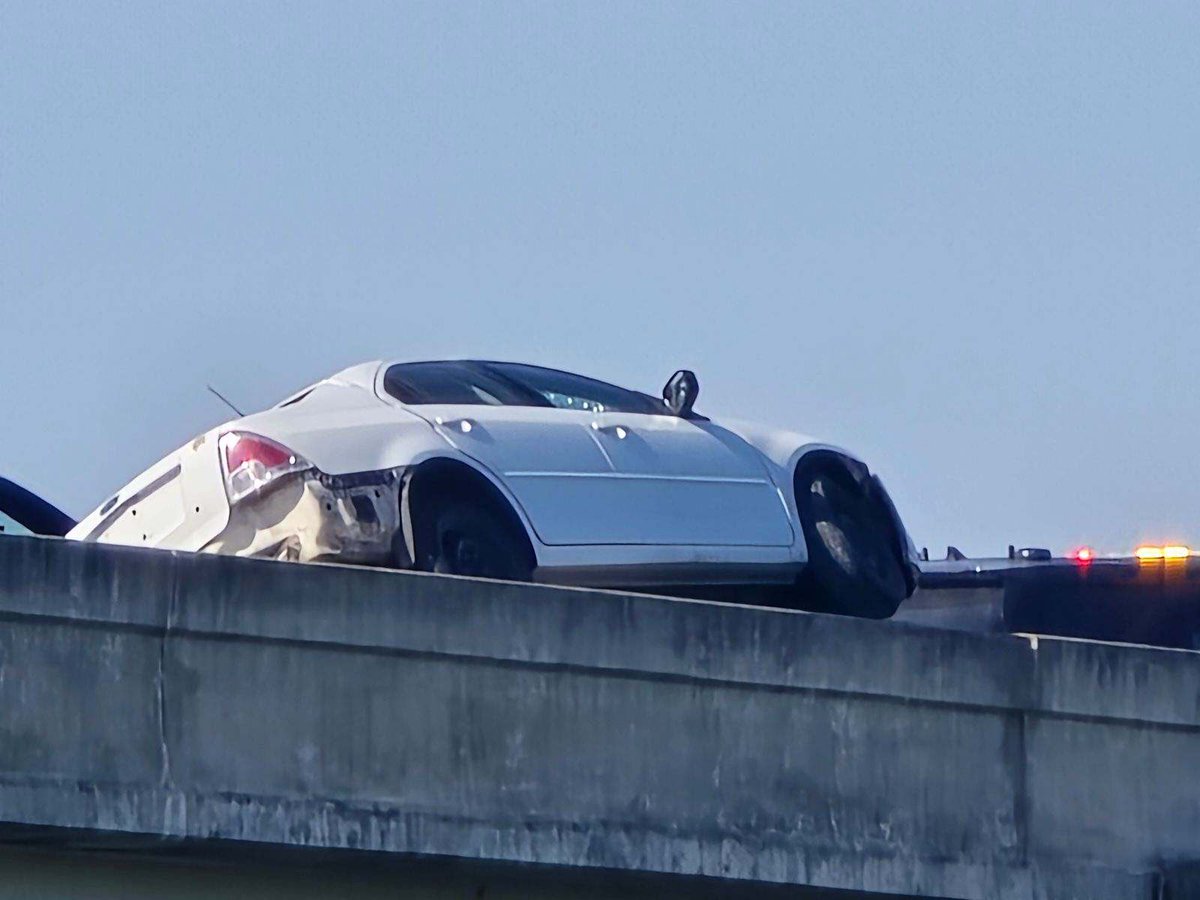 SA  pd along with Sa fire department are at a scene where a single vehicle is hinging from the side of a bridge. A tow truck is there to pull the car to safety. This at moursund rd and hwy 410. A lot of traffic. Avoid the area