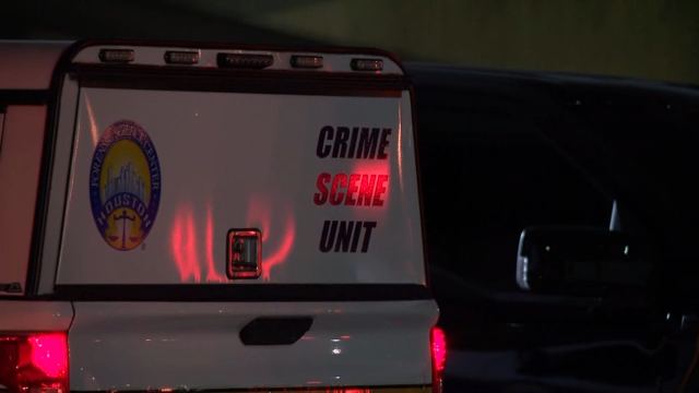 Police discover an unidentified man's body in the back of a patrol car