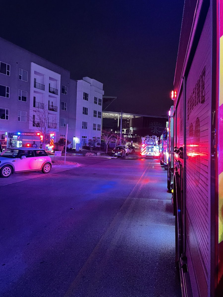 Austin firefighters on scene of a fire involving multiple dumpsters with fire extension unit the trash chute of an apartment building. Fire is now out, crews searching for additional fire and hazards