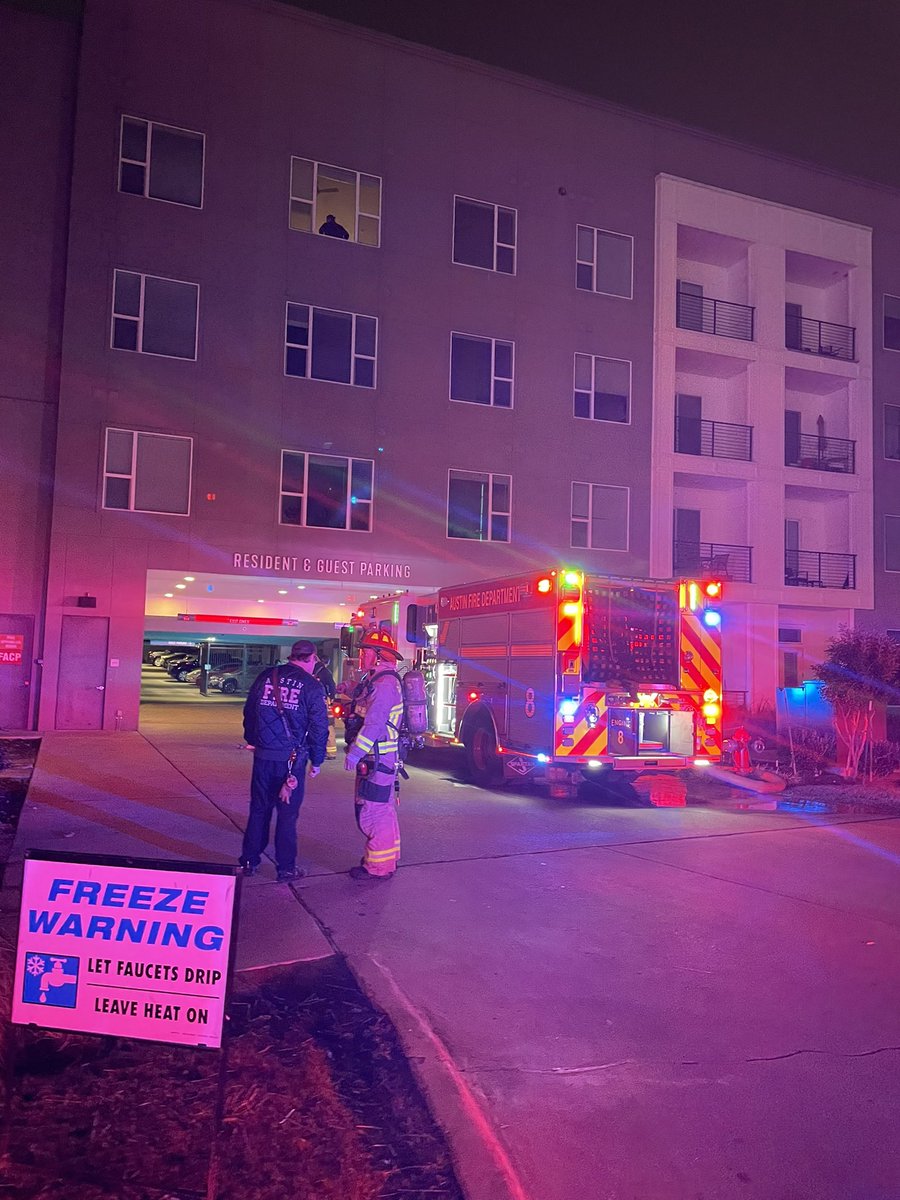 Austin firefighters on scene of a fire involving multiple dumpsters with fire extension unit the trash chute of an apartment building. Fire is now out, crews searching for additional fire and hazards