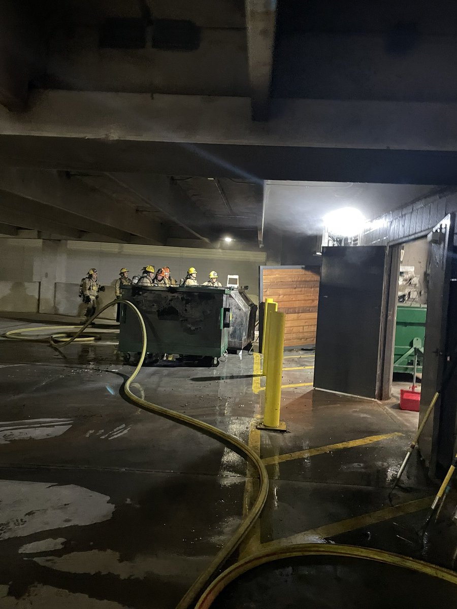 Austin firefighters on scene of a fire involving multiple dumpsters with fire extension unit the trash chute of an apartment building. Fire is now out, crews searching for additional fire and hazards