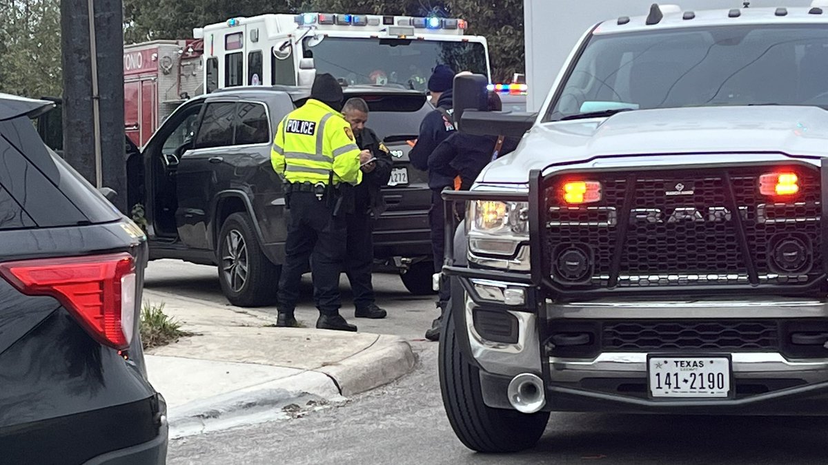 Woman runs out of her apartment and second person runs after. Police tell that the woman tried to drive off and the second person hung on to the mirror. The person was run over their arm by the front tire. Police investigating.Victim transported