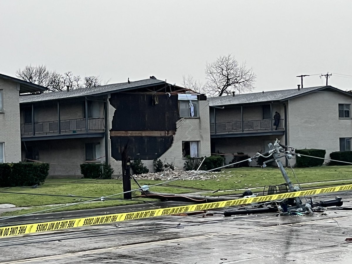 Storm damage in Irving at O’Connor/Pioneer. Police have not confirmed injuries so far but still checking. Hacienda Apartments have heavy damage to roof and façade. Power poles snapped in streets. Damage to multiple businesses. More roads will shut down to assess storm damage