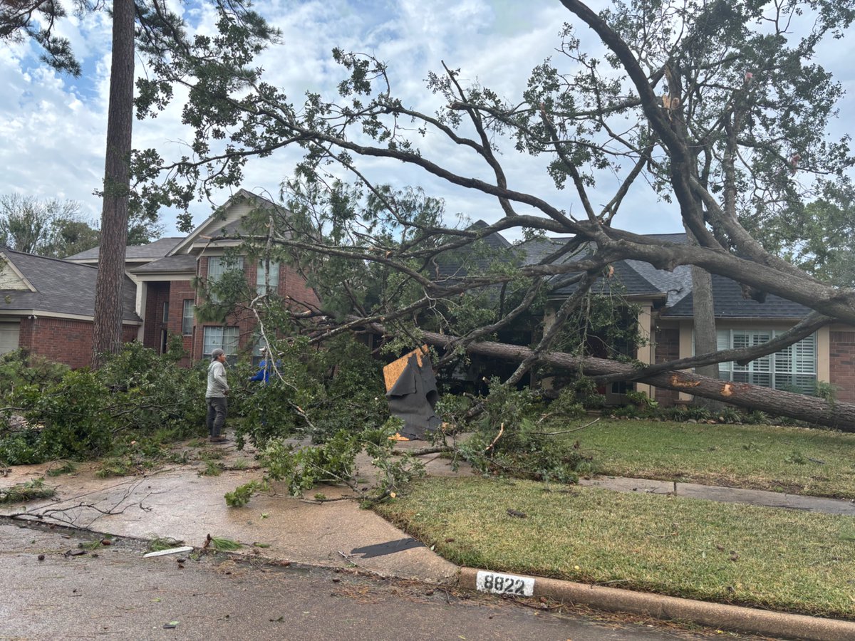 Confirmed structural damage and downed trees from an *unconfirmed* tornado in Spring, TX. This is along Village Hills Drive.