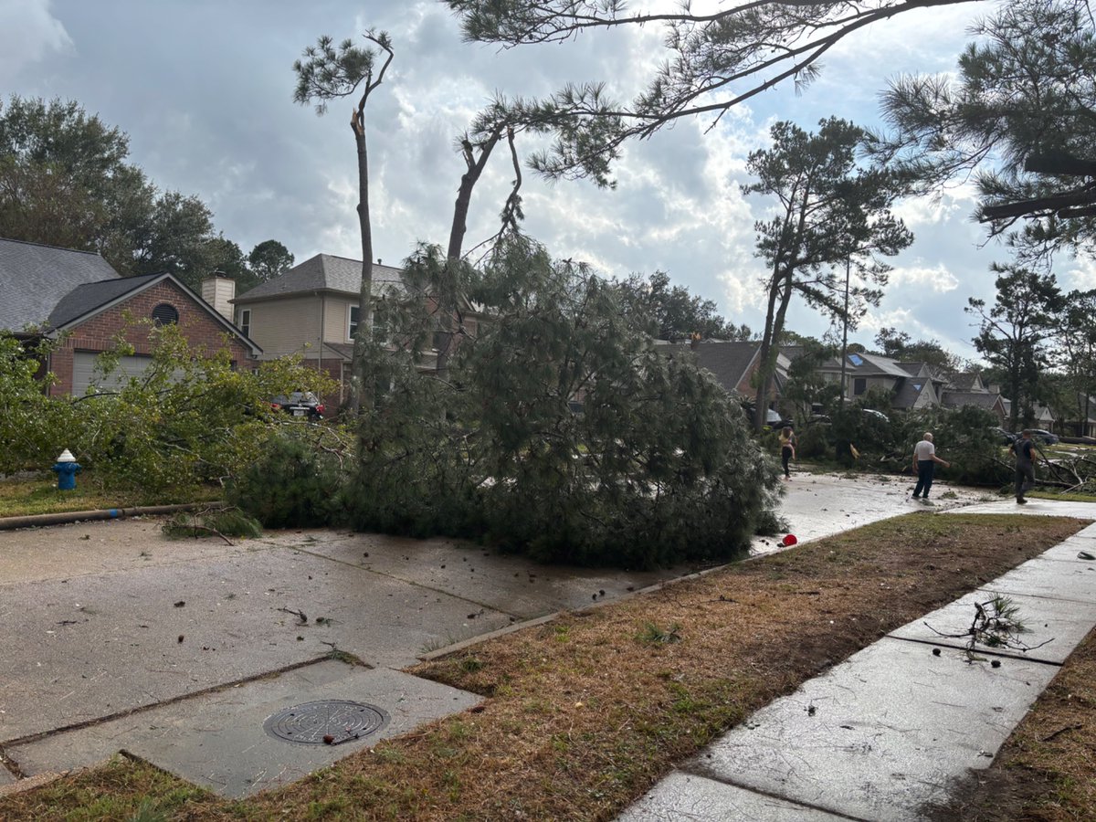 Confirmed structural damage and downed trees from an *unconfirmed* tornado in Spring, TX. This is along Village Hills Drive.