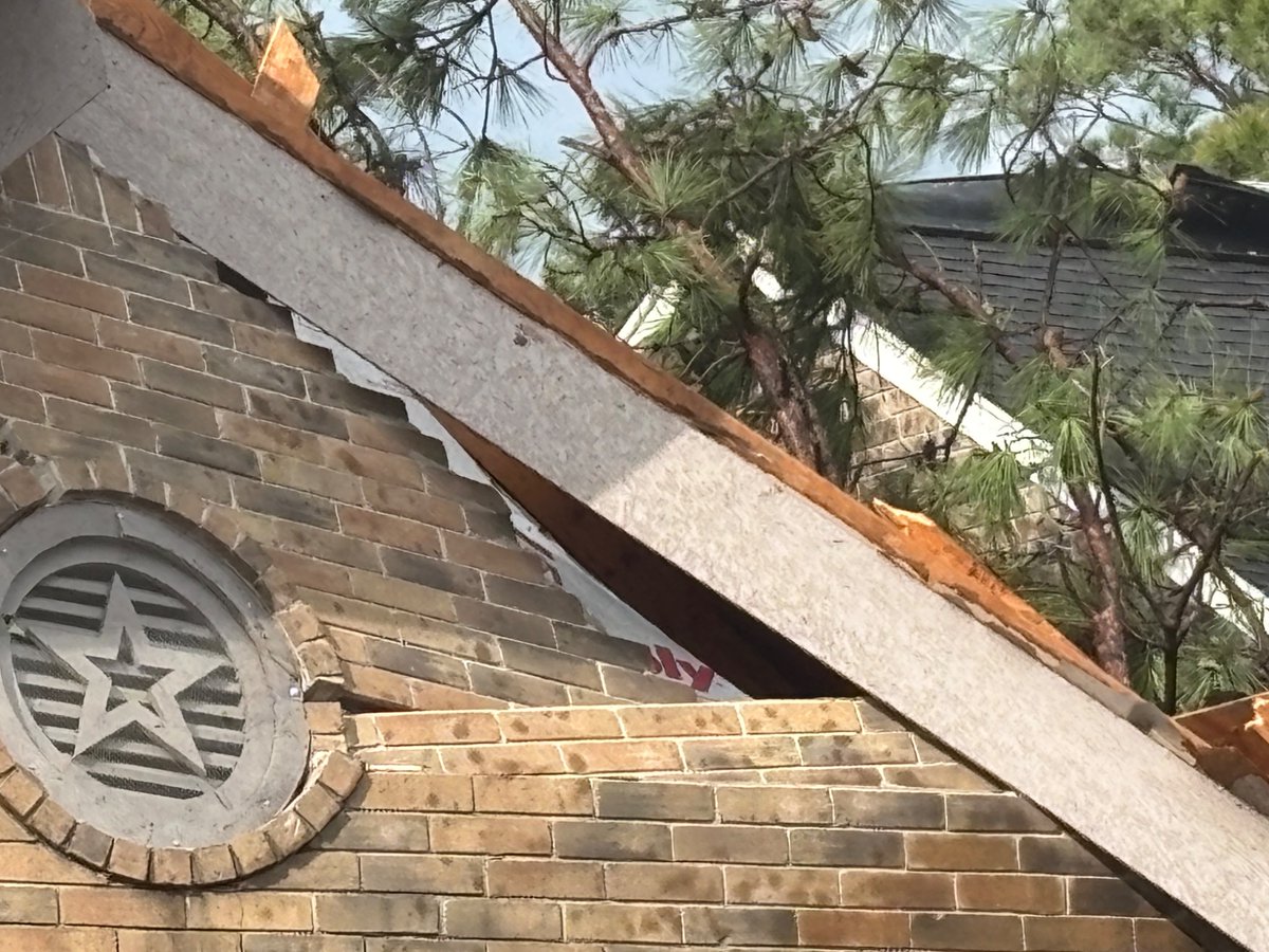 Confirmed structural damage and downed trees from an *unconfirmed* tornado in Spring, TX. This is along Village Hills Drive.