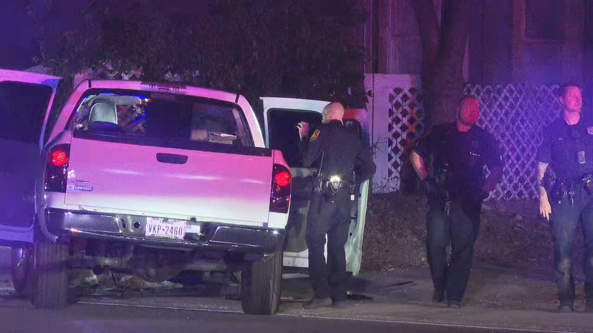 people were hospitalized after police say a drive-by shooting at an East Side intersection caused them to crash