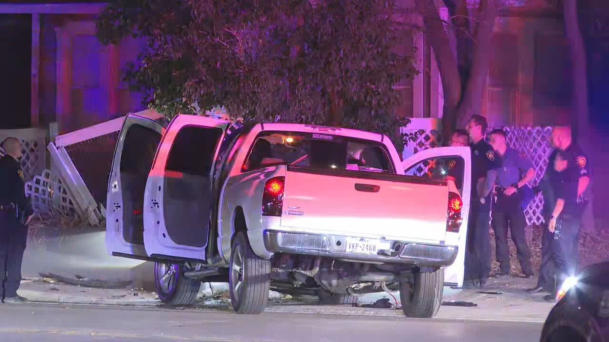 people were hospitalized after police say a drive-by shooting at an East Side intersection caused them to crash