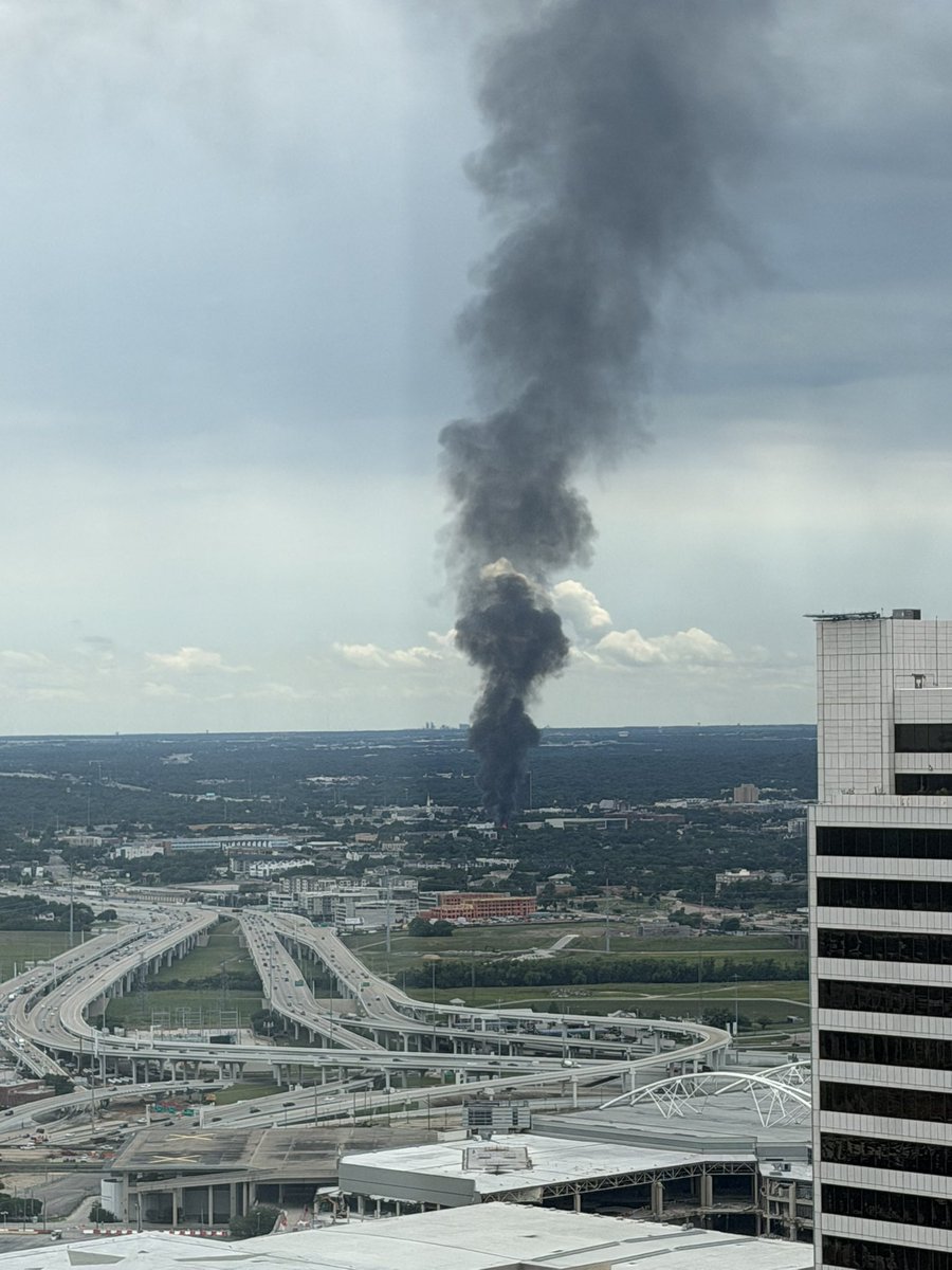 Large fire in the Oak Cliff neighborhood of Dallas, with flames—not just smoke, but flames—visible from miles away in downtown Dallas. Fire appears just west of I-35. Here’s the view from the 42nd floor of the Comerica Bank Tower