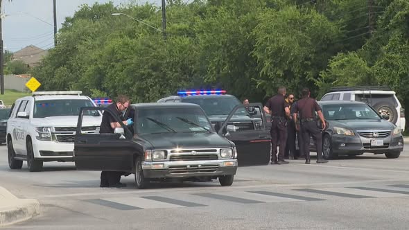 Police are searching for a gunman after a driver was found critically shot at a Far West Side intersection