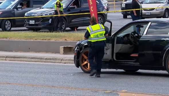 A woman and her dog have tragically died after being struck by a car while attempting to cross Marbach Road near West Military Drive